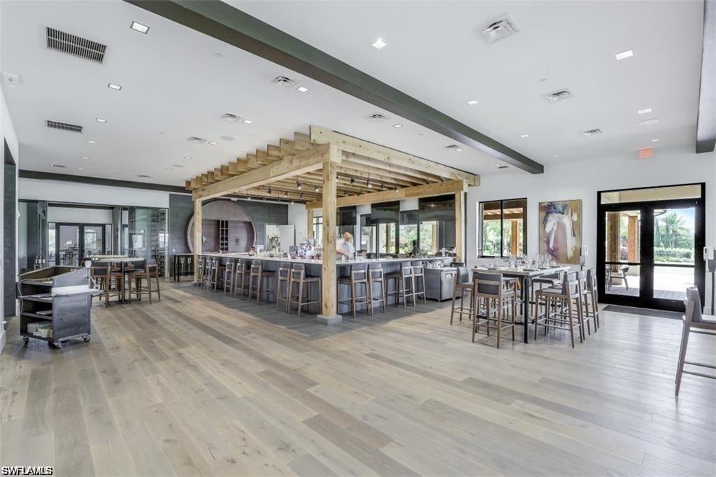 Dining area featuring french doors, recessed lighting, light wood-type flooring, and beamed ceiling