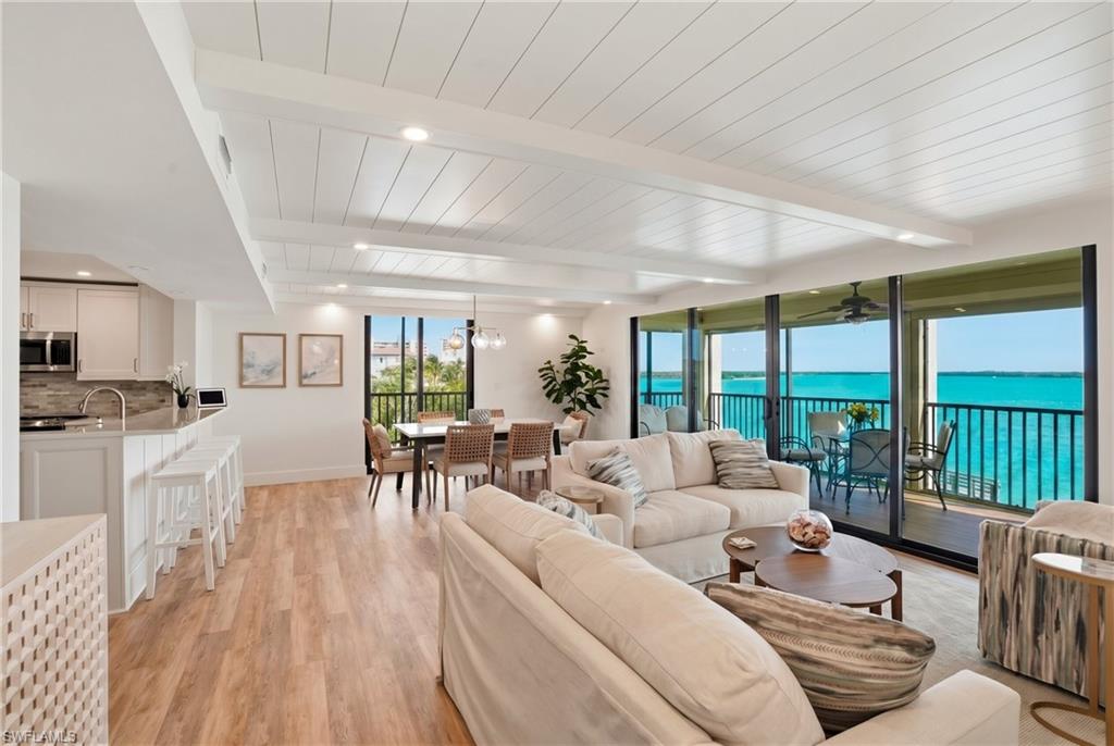 Expansive living area with water views - Virtually Edited Image