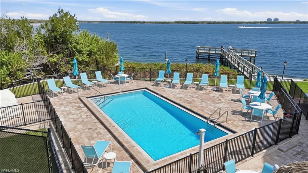 Community pool featuring a patio and  - Virtually Edited Imagea water view