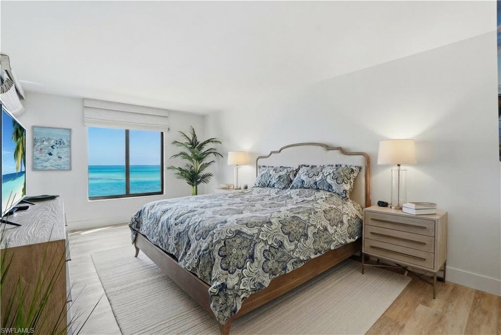 Expansive window featuring Bay views with remote controlled blinds- Virtually Edited Image