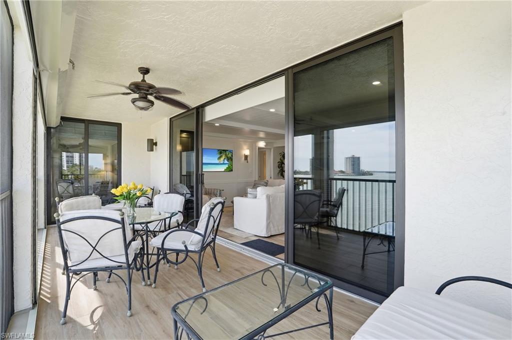 Hugh Lanai off of Family Room with ceiling fan, and outdoor dining space - Virtually Edited Image
