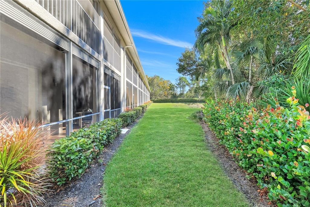 Rear of property with screened door leading outside.