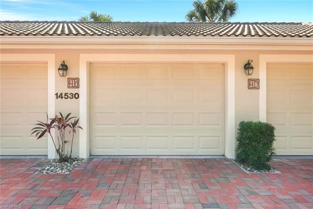 View of single car detached garage.
