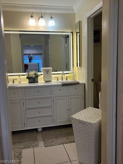 Full bathroom featuring double vanity, light tile patterned floors, and crown molding