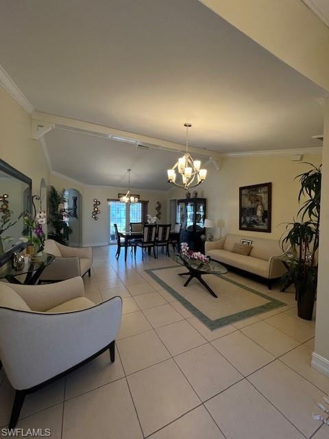 Living room with lofted ceiling, ornamental molding, light tile patterned floors, and suspended lighting