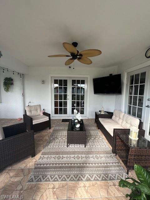 View of patio featuring french doors, an outdoor lounge area, and ceiling fan