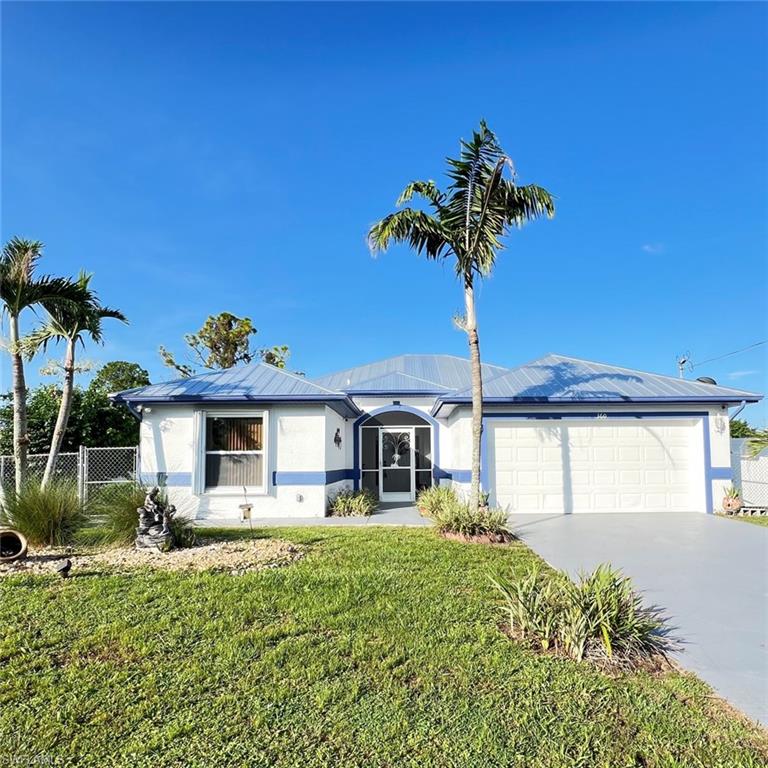Single-story residence featuring a blue metal roof and white exterior with blue trim accents
