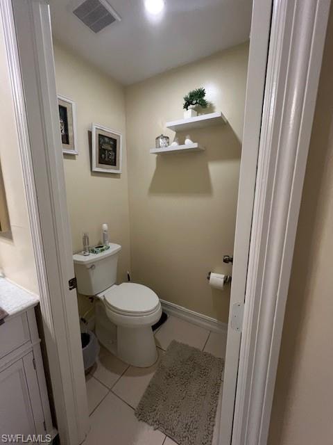 Bathroom featuring light tile patterned flooring and vanity
