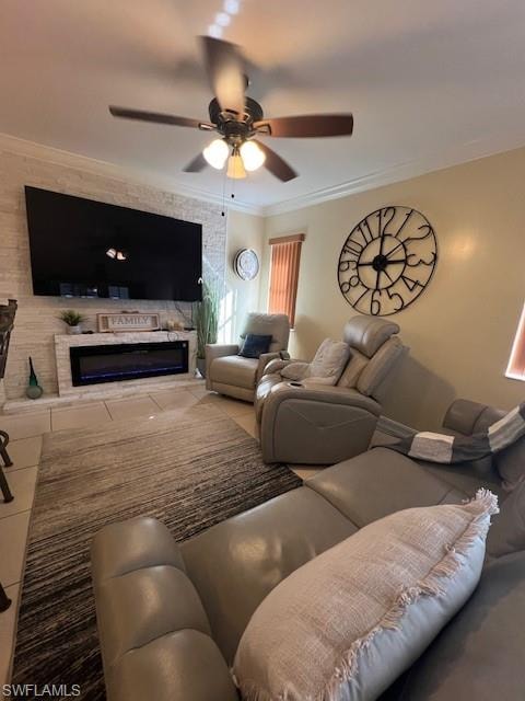 Living area with a ceiling fan, crown molding, and tile patterned floors