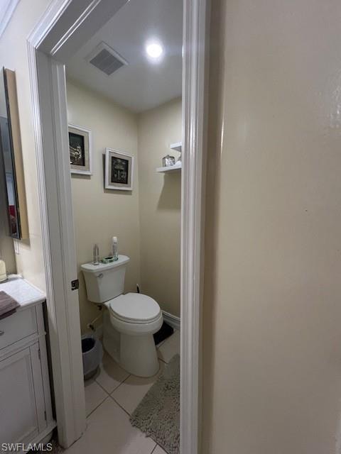 Bathroom featuring light tile patterned floors and vanity