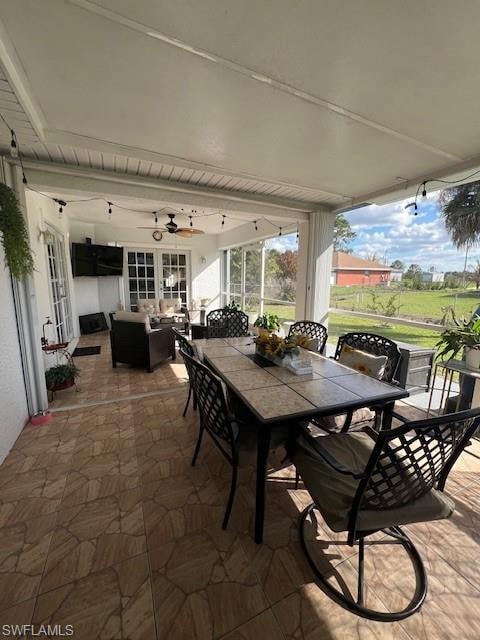 View of patio / terrace featuring a ceiling fan and outdoor lounge area