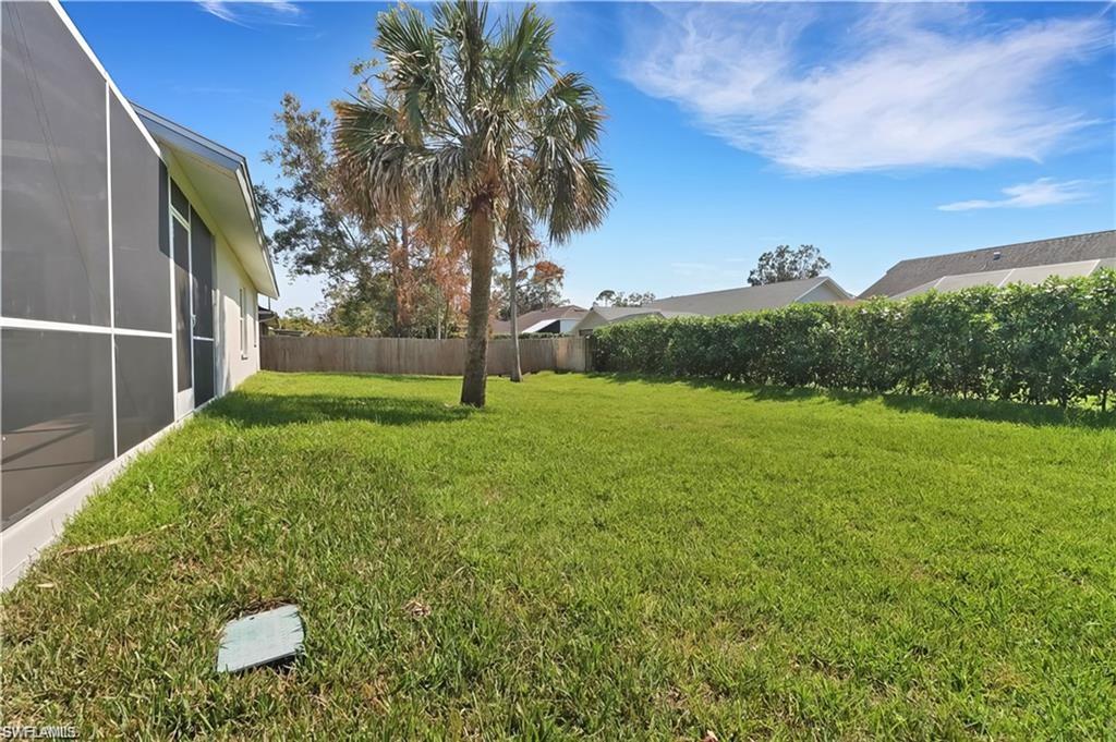 View of fenced backyard