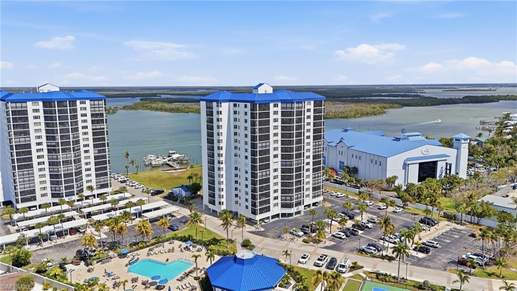 Drone / aerial view of a large body of water and apartment complex / building - Virtually Edited Image