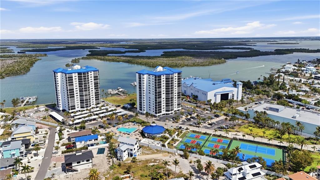 Aerial view of a large body of water and apartment complex / building - Virtually Edited Image