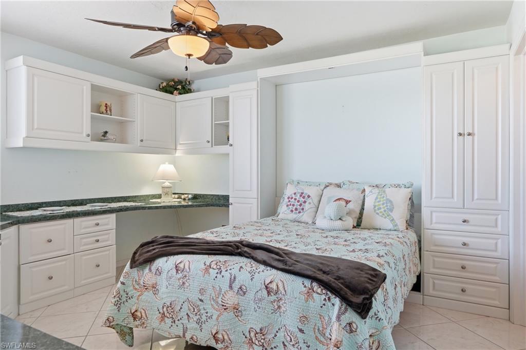 Bedroom with built in desk and ceiling fan - Virtually Edited Image