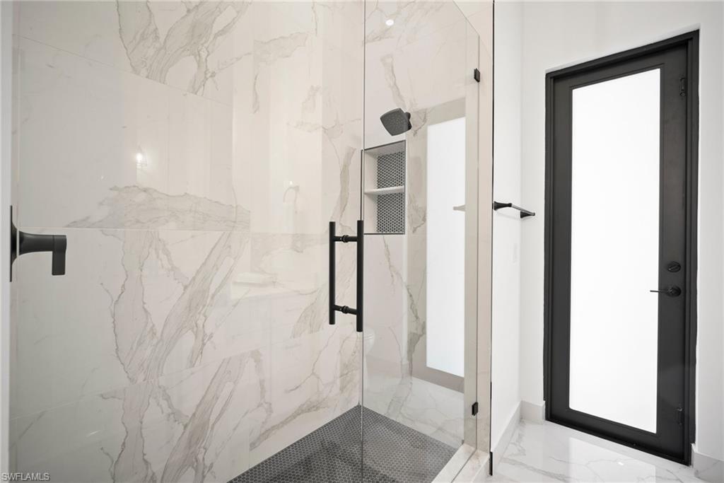 Bathroom with a shower with shower door