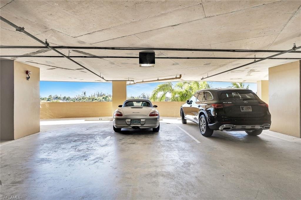 View of parking garage with 2 assigned parking spots