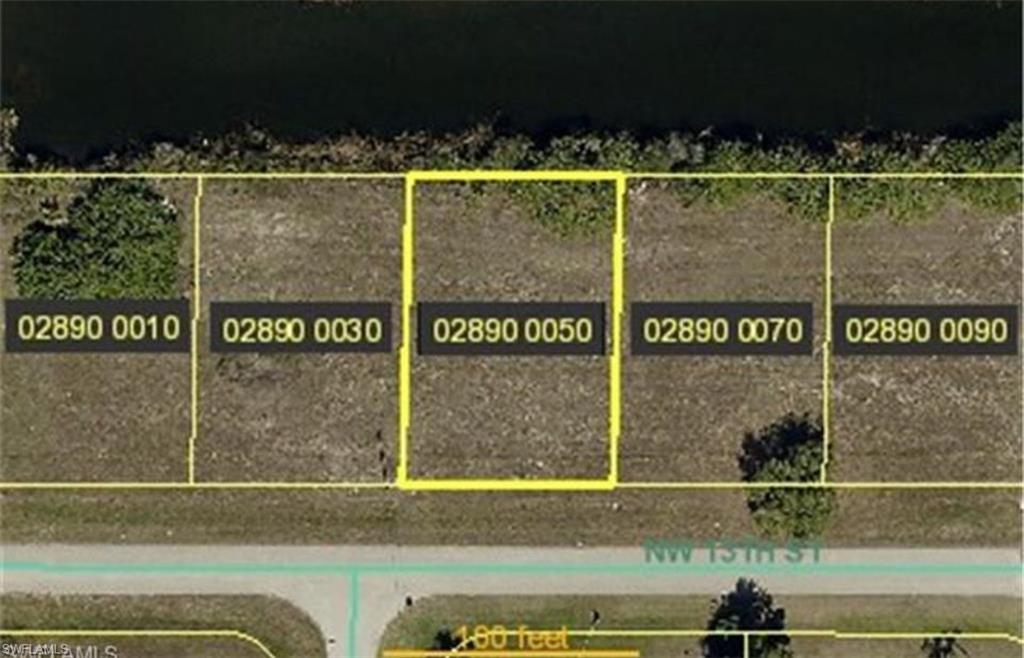 Aerial map of property and surrounding area featuring property boundaries highlighted