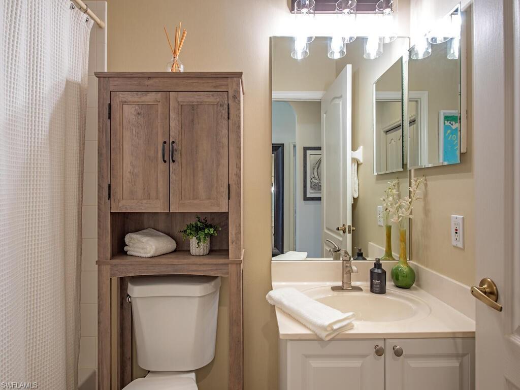 Full bath featuring vanity and shower / bath combo