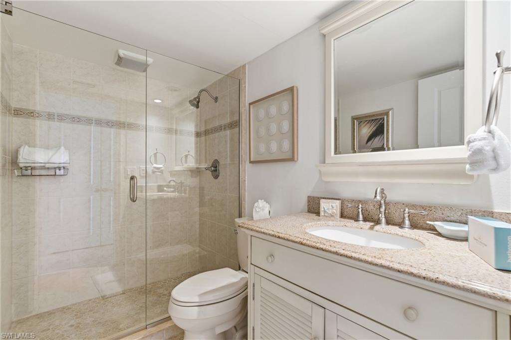 Guest bathroom also nicely updated including a walk-in shower with updated shower glass door.  Photo may be digitally enhanced
