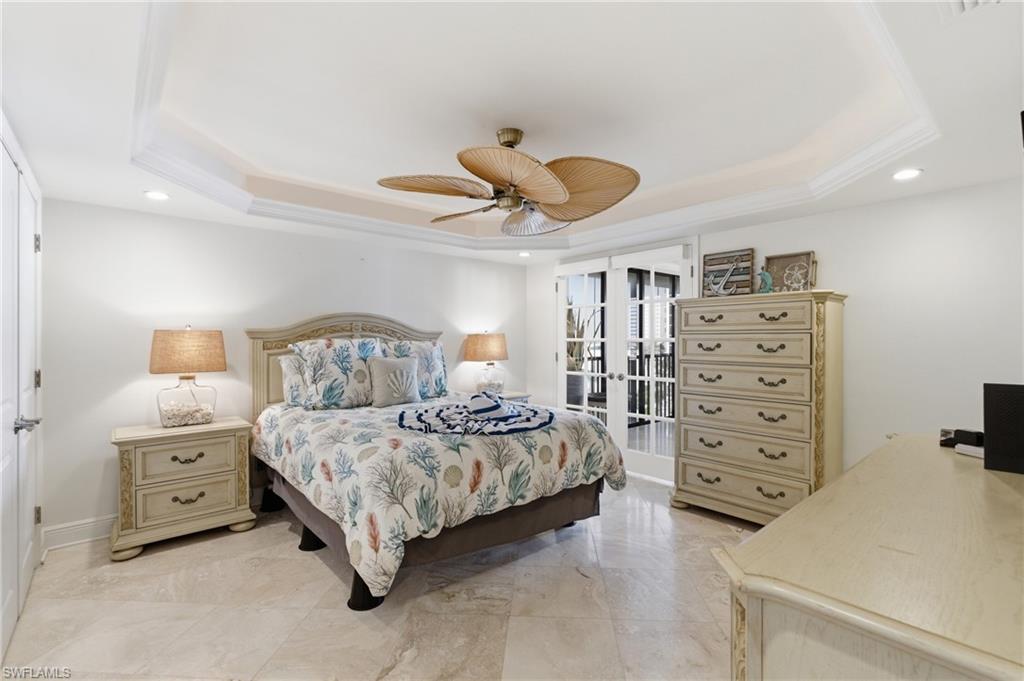 Primary Bedroom with beautiful cermamic tile and airy feeling of sunshine. Photo may be digitally enhanced.