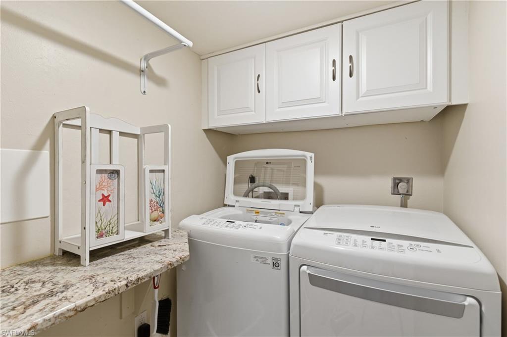 Spacious laundry room in the unit. Photo may be digitally enhanced