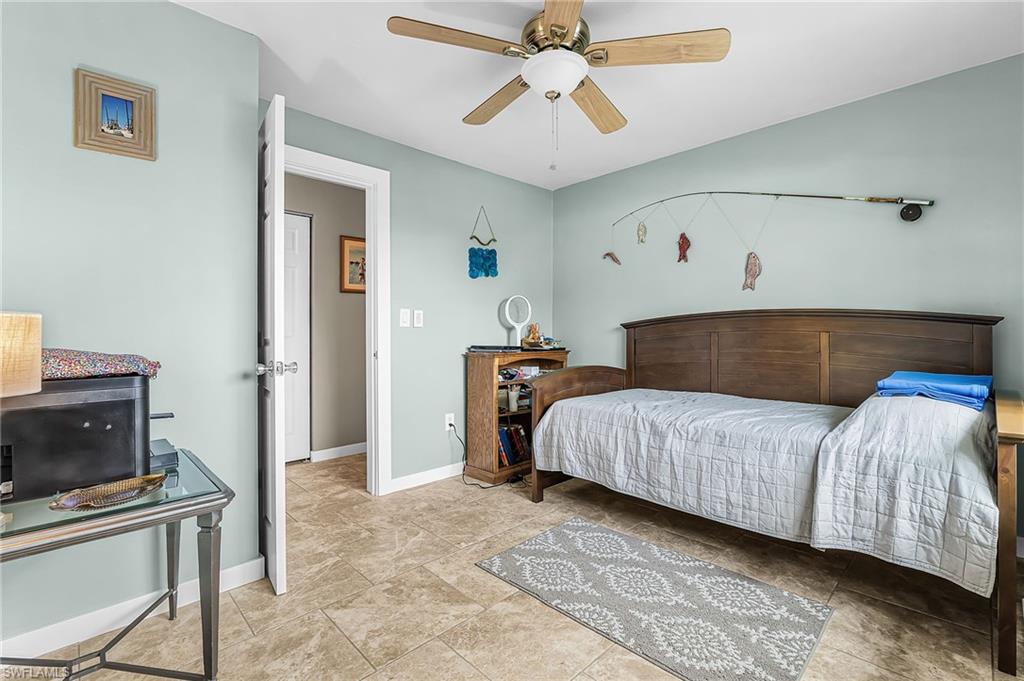 Bedroom featuring lofted ceiling and a ceiling fan