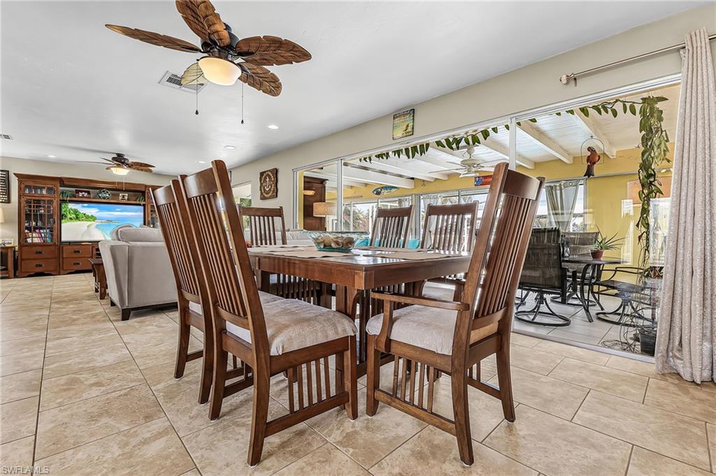 Dining space featuring a ceiling fan, healthy amount of natural light, and recessed lighting