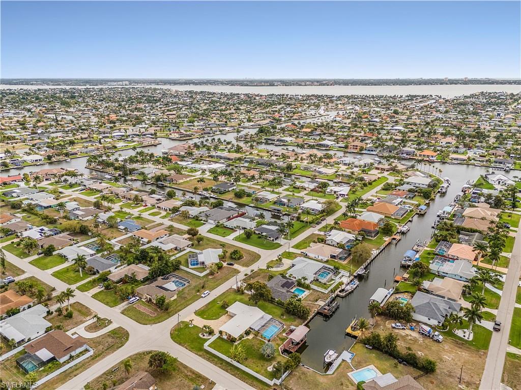 Aerial perspective of suburban area with a large body of water