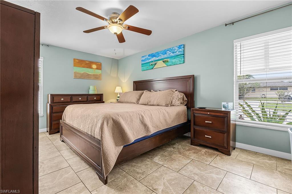 Bedroom featuring ceiling fan and light tile patterned flooring