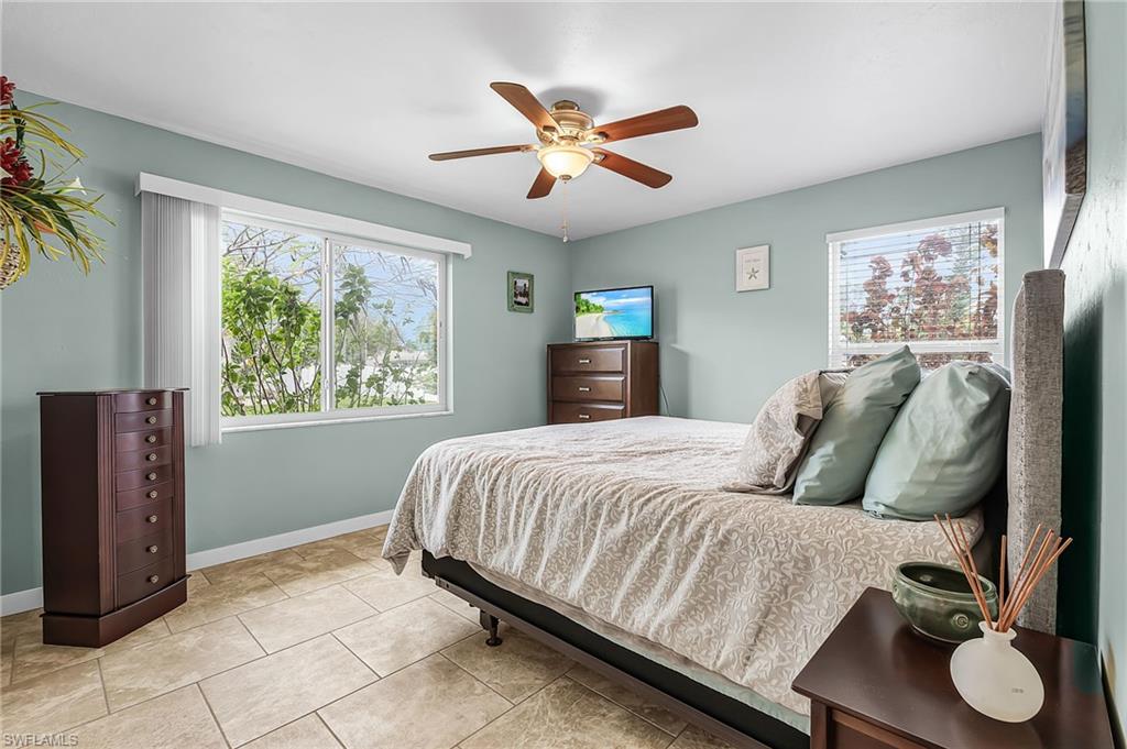 Bedroom featuring a ceiling fan and light tile patterned floors