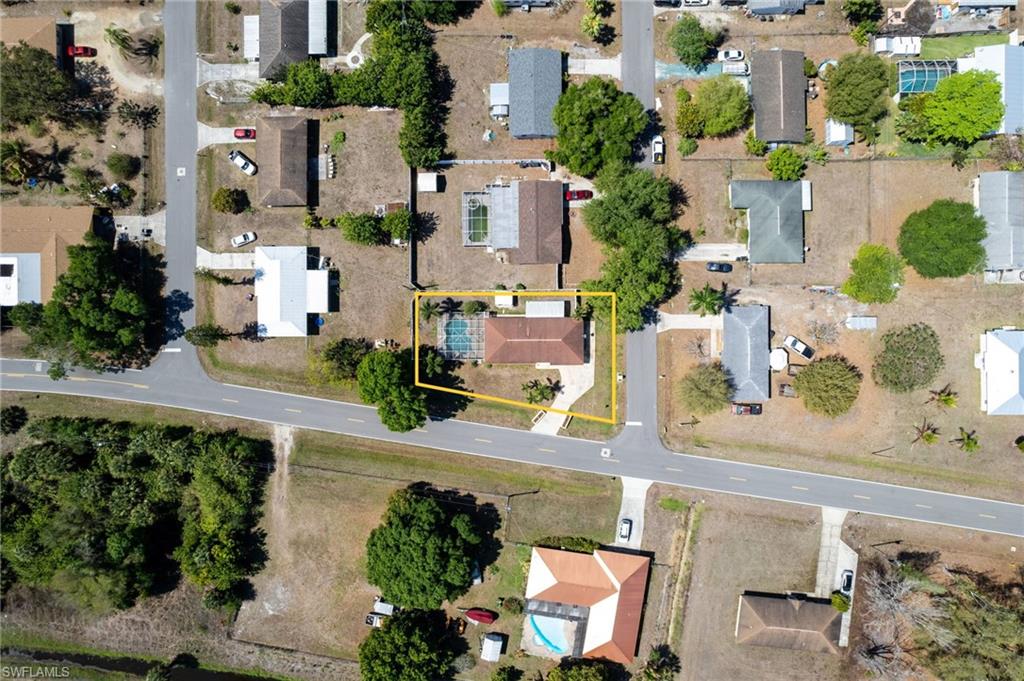 Aerial perspective of suburban area with property parcel outlined