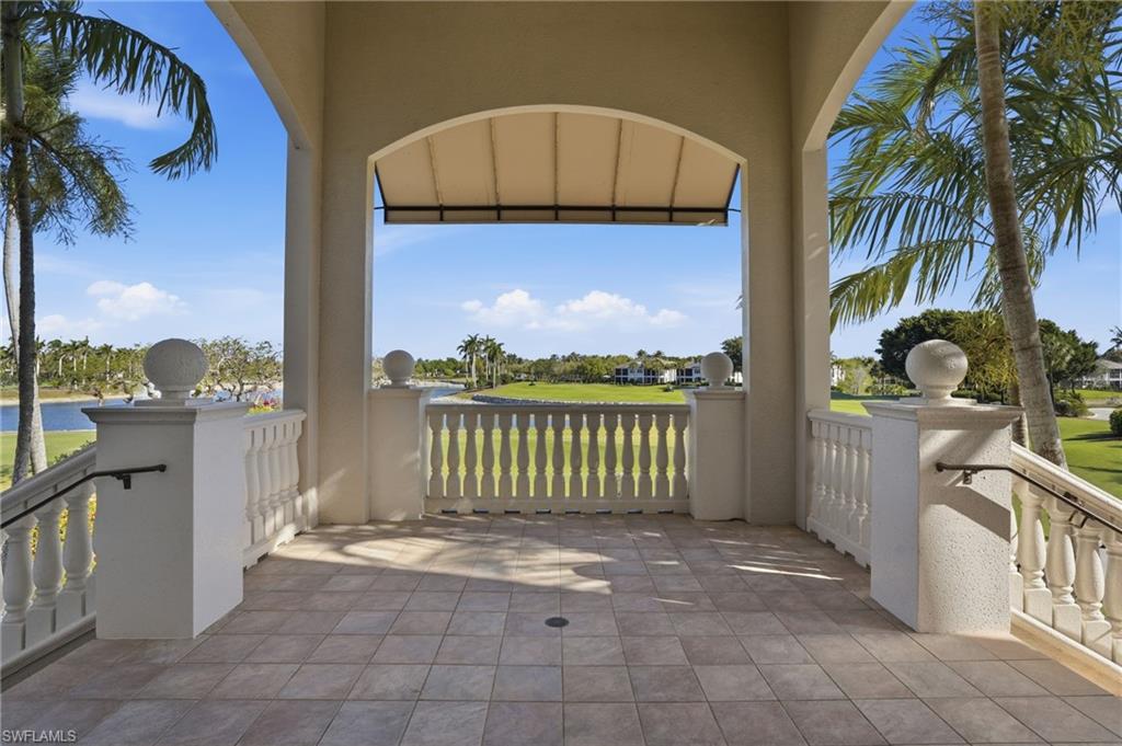 View of patio with a water view at Golf Lodge