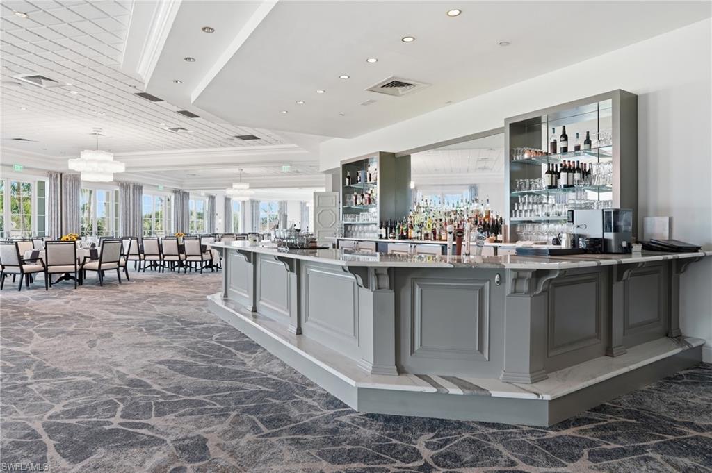Bar with light stone countertops, at Golf Lodge
