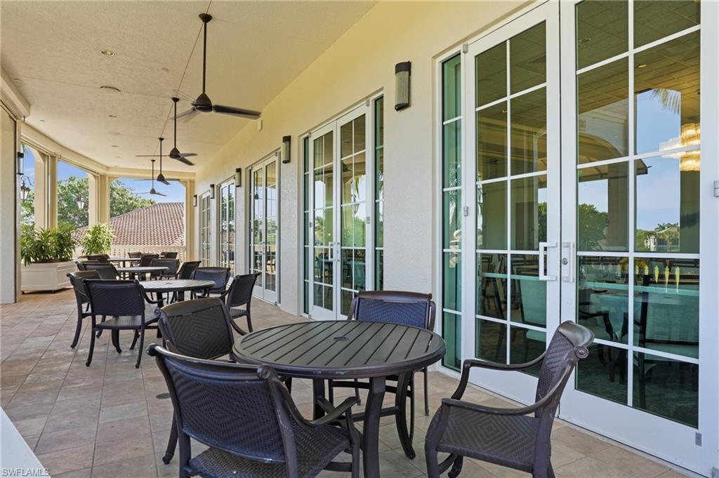 View of patio / terrace with french doors, outdoor dining area, and a ceiling fan