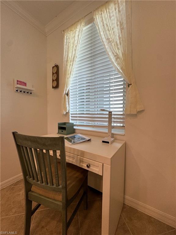 Dining area with crown molding and a healthy amount of sunlight