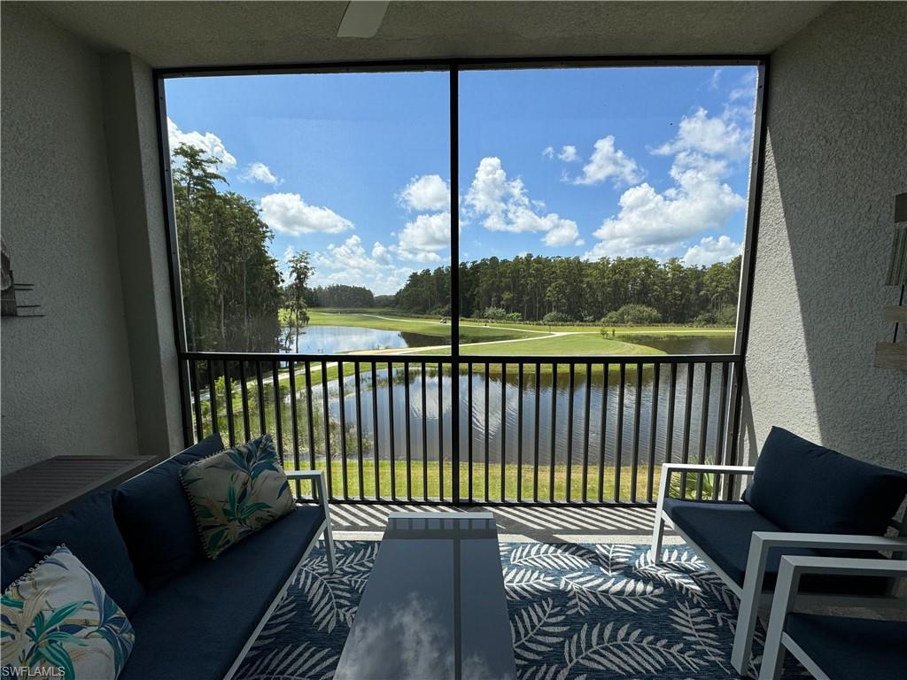 Sunroom with a water view and plenty of natural light