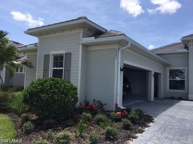 View of property exterior featuring a garage