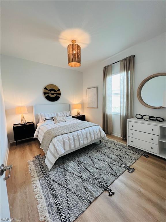 Bedroom featuring wood-type flooring
