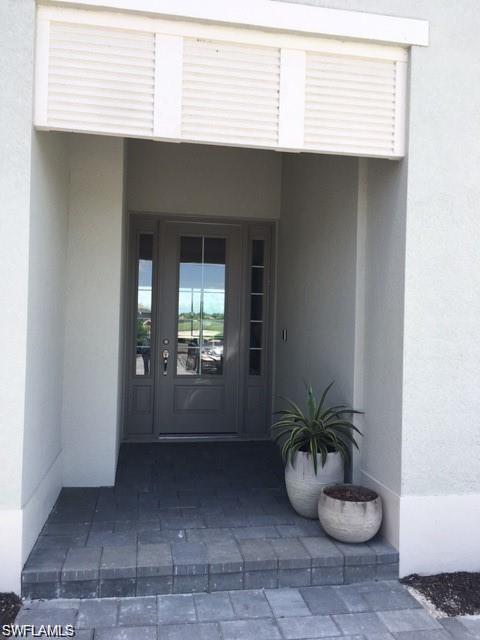 View of exterior entry featuring french doors