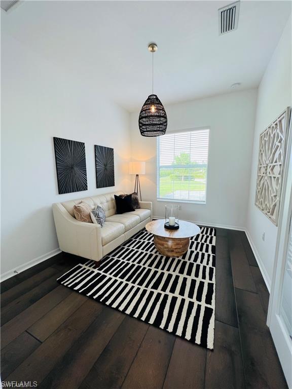 Living room featuring dark hardwood / wood-style floors