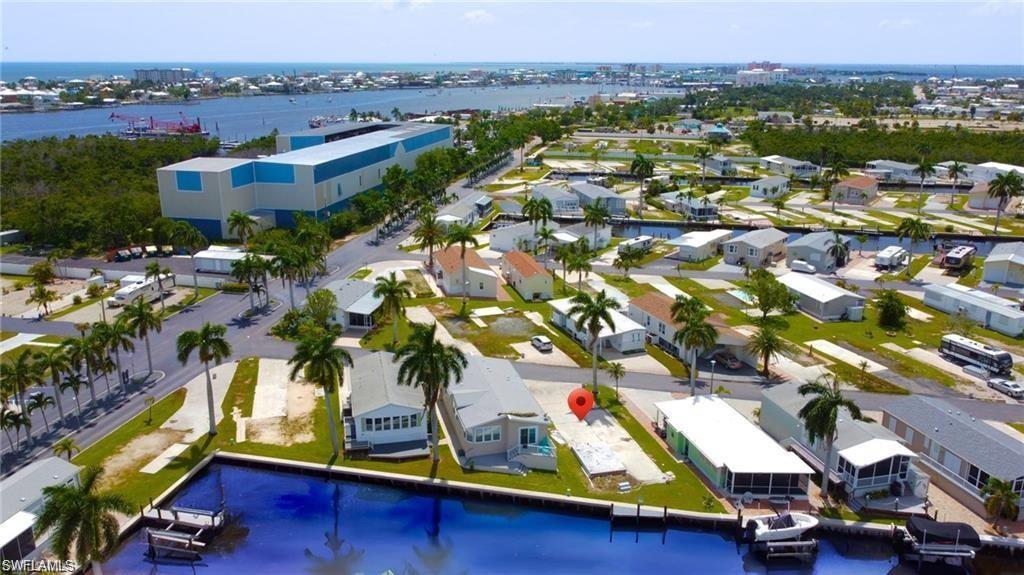 Aerial view - of property and surrounding bodies of water- virtually enhanced