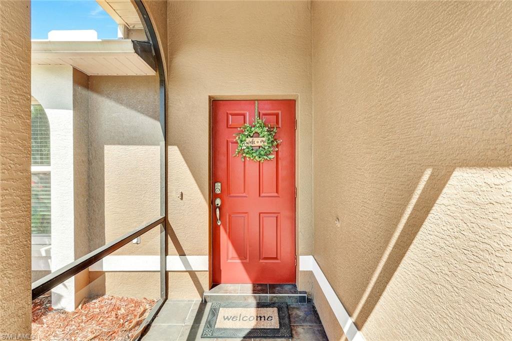 View of exterior entry with stucco siding