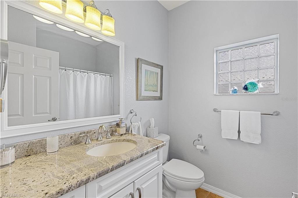 Full bath with vanity and a shower with curtain