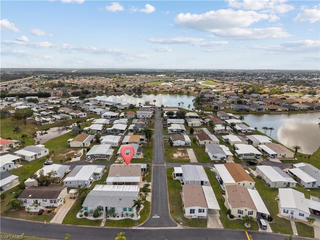 Aerial perspective of suburban area featuring a large body of water