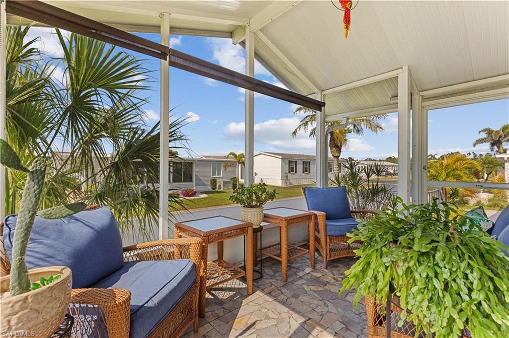 Sunroom featuring an outdoor living space