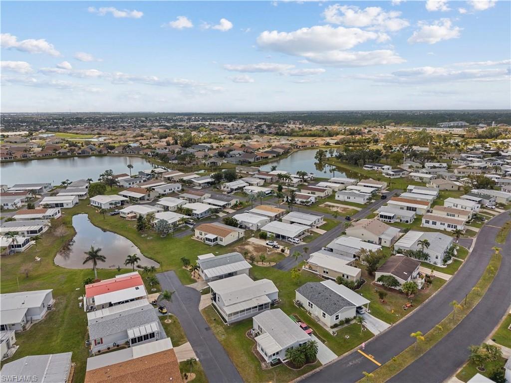 Aerial perspective of suburban area with a large body of water