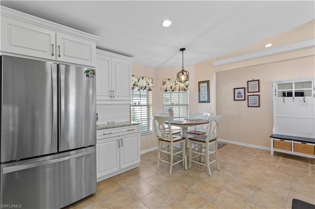 Dining room with recessed lighting and baseboards