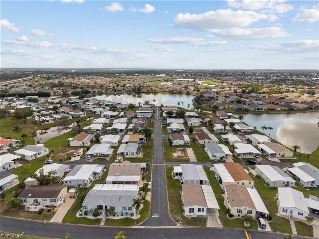 Aerial perspective of suburban area with a nearby body of water