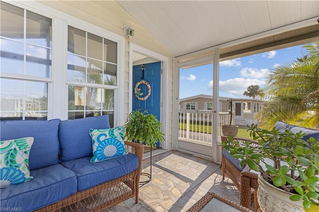 Sunroom featuring lofted ceiling